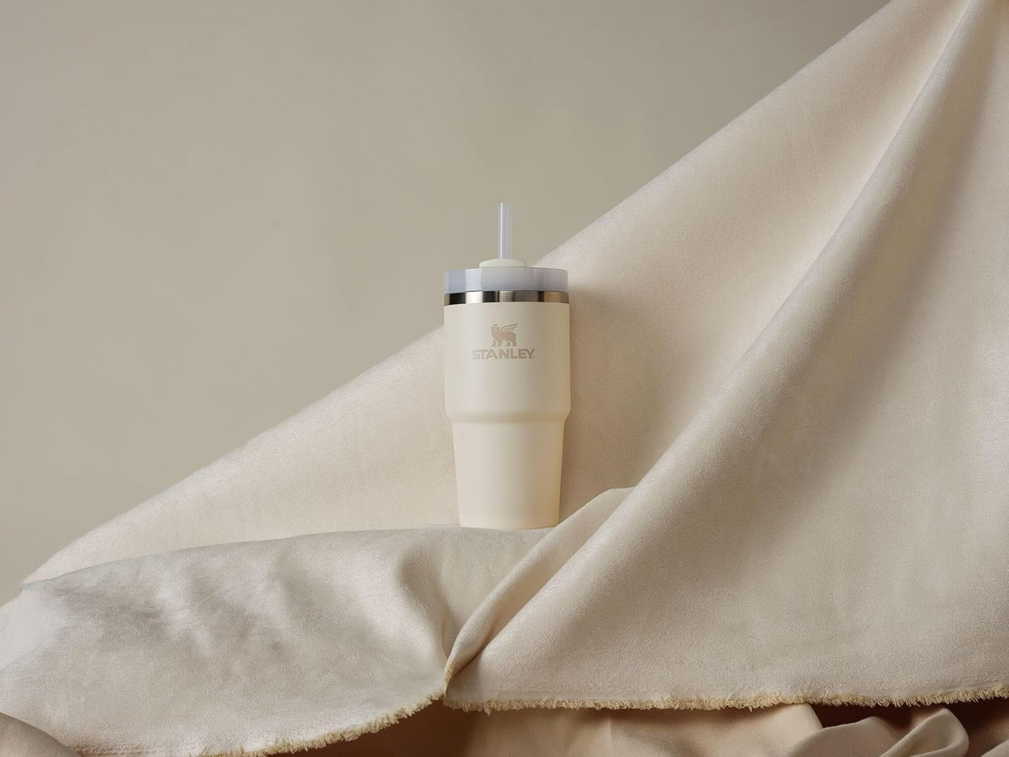 Stanley Quencher H2.0 Tumbler with Straw 20 oz | Flowstate 3-Position Lid | Cup Holder Compatible for Travel | Insulated Stainless Steel Cup | BPA-Free | Cream 2.0